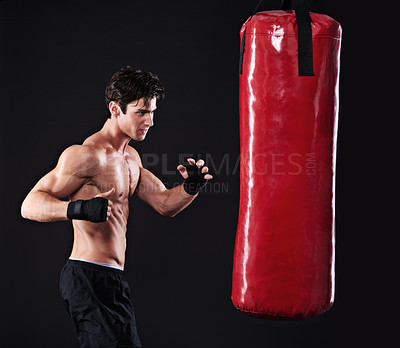 Buy stock photo Man, punching bag and challenge with fitness, workout and fighter with gloves and wellness with training. Boxer, practice and athlete with exercise and cardio with endurance, healthy guy and progress