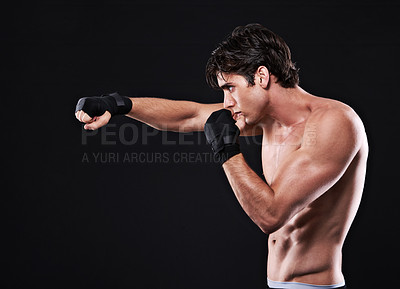 Buy stock photo Fitness, mma and man punching in studio for exercise, challenge or competition training for boxing. Power, muscle or profile of champion boxer at workout with confidence, fight and black background