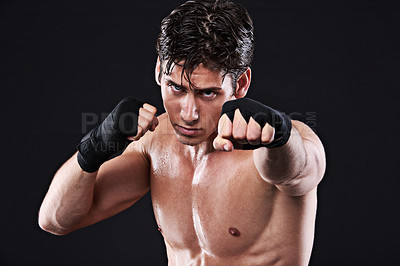 Buy stock photo Sports, boxing and portrait or man training, workout and exercise for mma fighting in studio. Serious, male athlete and  shirtless boxer, punch and strike in martial arts practice on black background