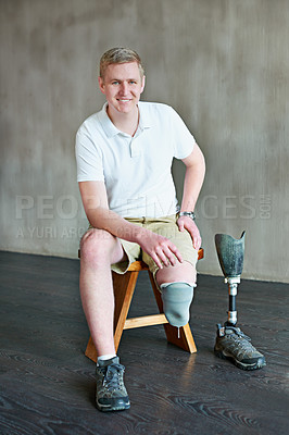 Buy stock photo Man, amputee and portrait on chair in gym, physical rehabilitation and exercise for wellness. Male person, physiotherapy and training with disability, athlete and strong core for muscle development
