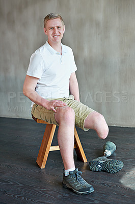 Buy stock photo Man, happy and amputee with prosthetic leg in gym sitting, residual limb for balance. Workout, physiotherapy and fitness for wellness or male person with disability, exercise and rehabilitation