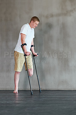 Buy stock photo Patient with disability, crutches and physical therapy for walking at clinic for recovery, strength and healthcare rehabilitation. Physiotherapy, support and consultation or care for amputee or man