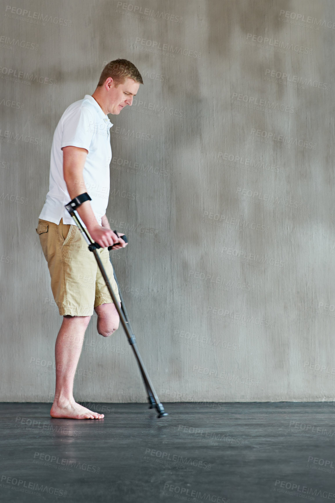 Buy stock photo Physical therapy, patient with disability or amputee walking with crutches at clinic for recovery, strength and healthcare rehabilitation. Physiotherapy, support and consultation or workout for man
