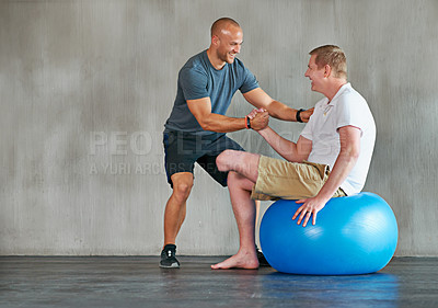 Buy stock photo Physical therapy, amputee and exercise ball with a man with a disability and physio for rehabilitation. Physiotherapy, help and healthcare professional with trainer helping and wellness for mobility