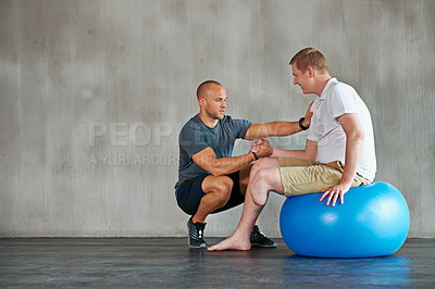 Buy stock photo Physical therapy, gym help and exercise ball with a man with a disability and physio consultation for rehabilitation. Physiotherapy and healthcare professional with helping and wellness for mobility
