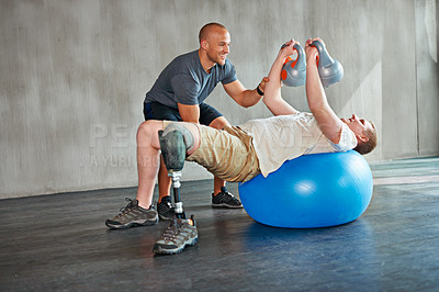 Buy stock photo Amputee, physiotherapist and help with kettlebells or exercise ball at gym for recovery, strength and healthcare rehabilitation. Physiotherapy, coach and support or consultation or workout for man