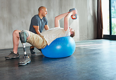 Buy stock photo Physiotherapy, disability and patient with kettlebell or exercise ball at gym for recovery, strength and healthcare rehabilitation. Physiotherapist, wellness and support or consultation for amputee