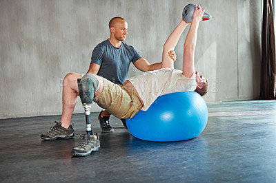 Buy stock photo Patient with disability, physiotherapist and help with kettlebell for stretching at gym for recovery, strength and healthcare rehabilitation. Physiotherapy, coach and client for support with exercise