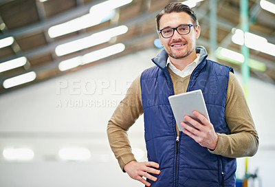 Buy stock photo Portrait of a man with a digital tablet working in a distribution warehouse