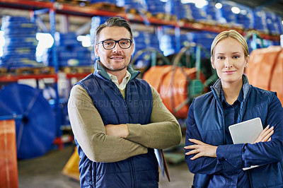 Buy stock photo Portrait of two people working in a large warehouse