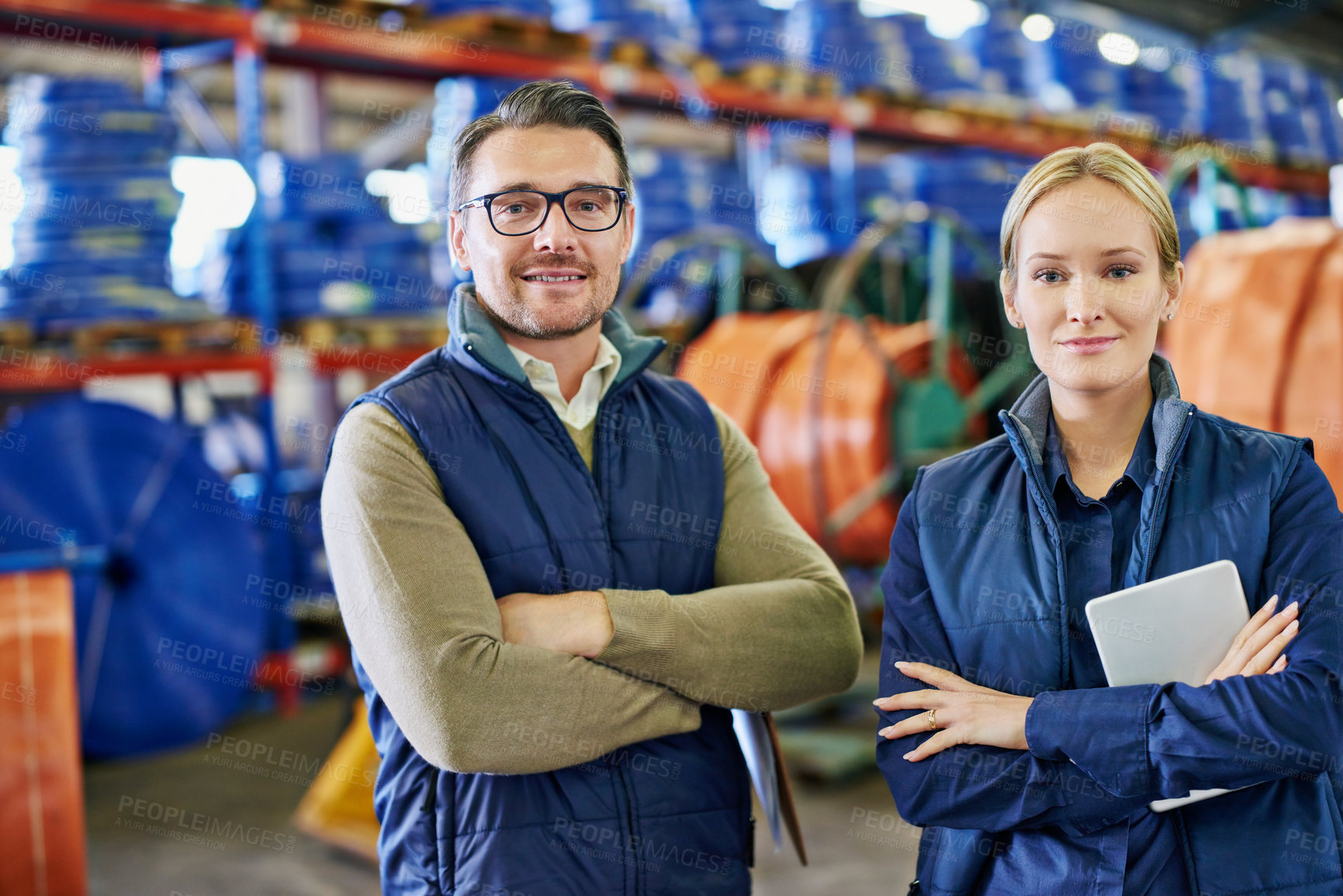 Buy stock photo Portrait of two people working in a large warehouse