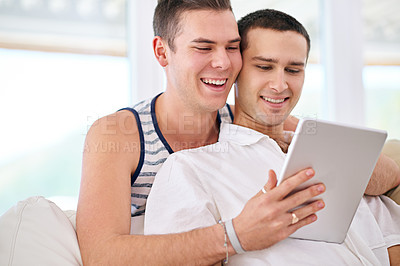 Buy stock photo Tablet, smile and gay couple on sofa for video, movie or social media, sign up or streaming service at home. LGBTQ, love and people hug in living room with digital, app and chill in a house