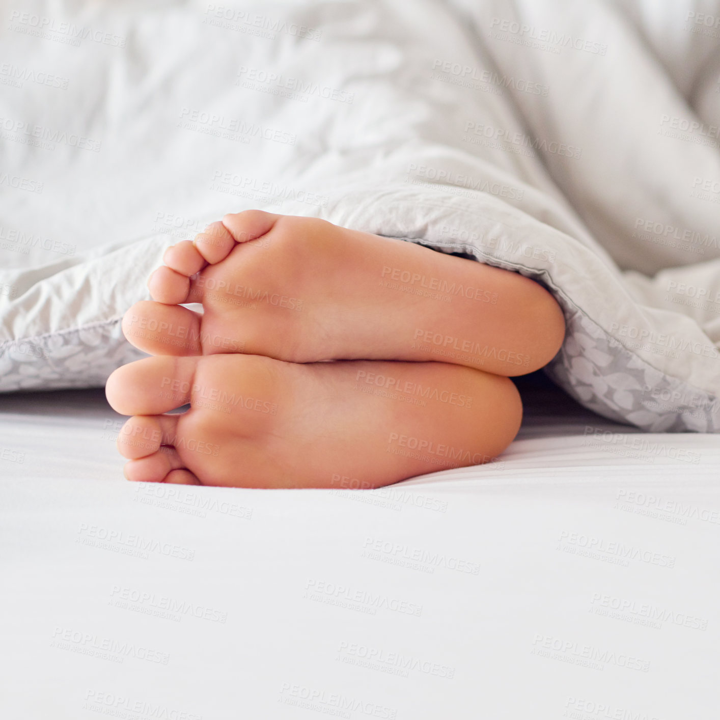 Buy stock photo Feet, person and soles in bed with blanket for sleeping, comfort and warmth in the morning. Foot, toes and heels with duvet cover in bedroom on mattress for relax, tired and cozy in house on weekend