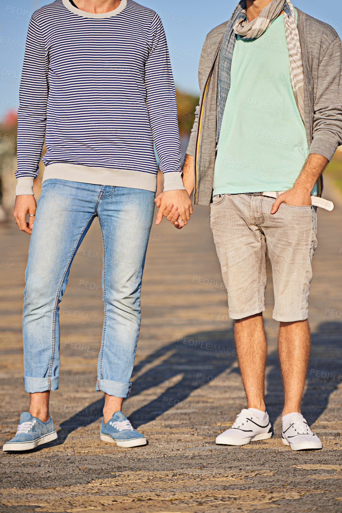 Buy stock photo Holding hands, couple and clothes for fashion on road, location and city of Cape Town for love. Gay, person and partner with pride for relationship on date, sunshine and summer to relax and aesthetic