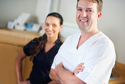 Buy stock photo Dentist, dental assistant and clinic in portrait, smile and office for oral, health and stomatology. Man, woman and dentistry for healthcare with confidence, positivity and professional in hospital