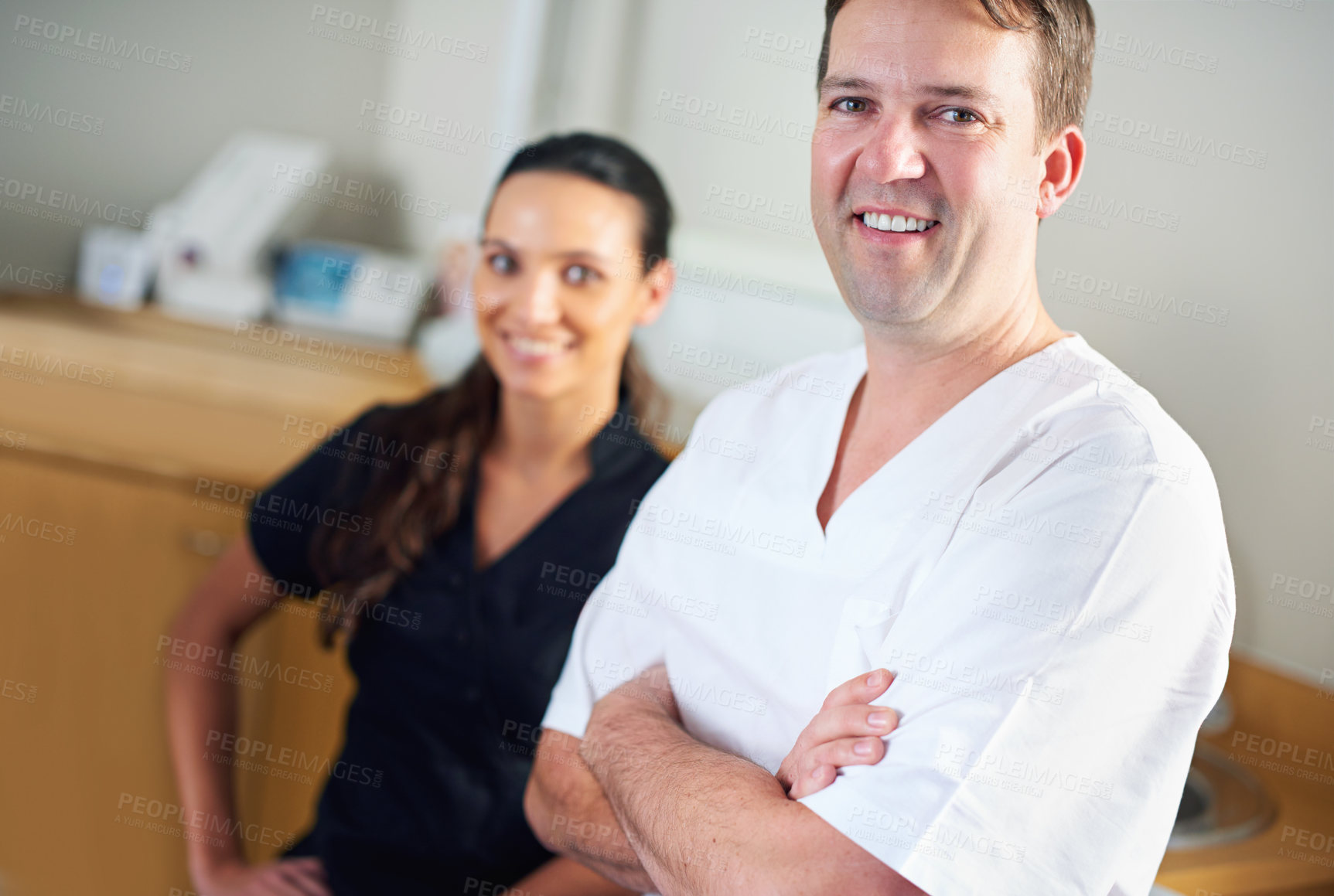 Buy stock photo Dentist, dental assistant and clinic in portrait, smile and office for oral, health and stomatology. Man, woman and dentistry for healthcare with confidence, positivity and professional in hospital