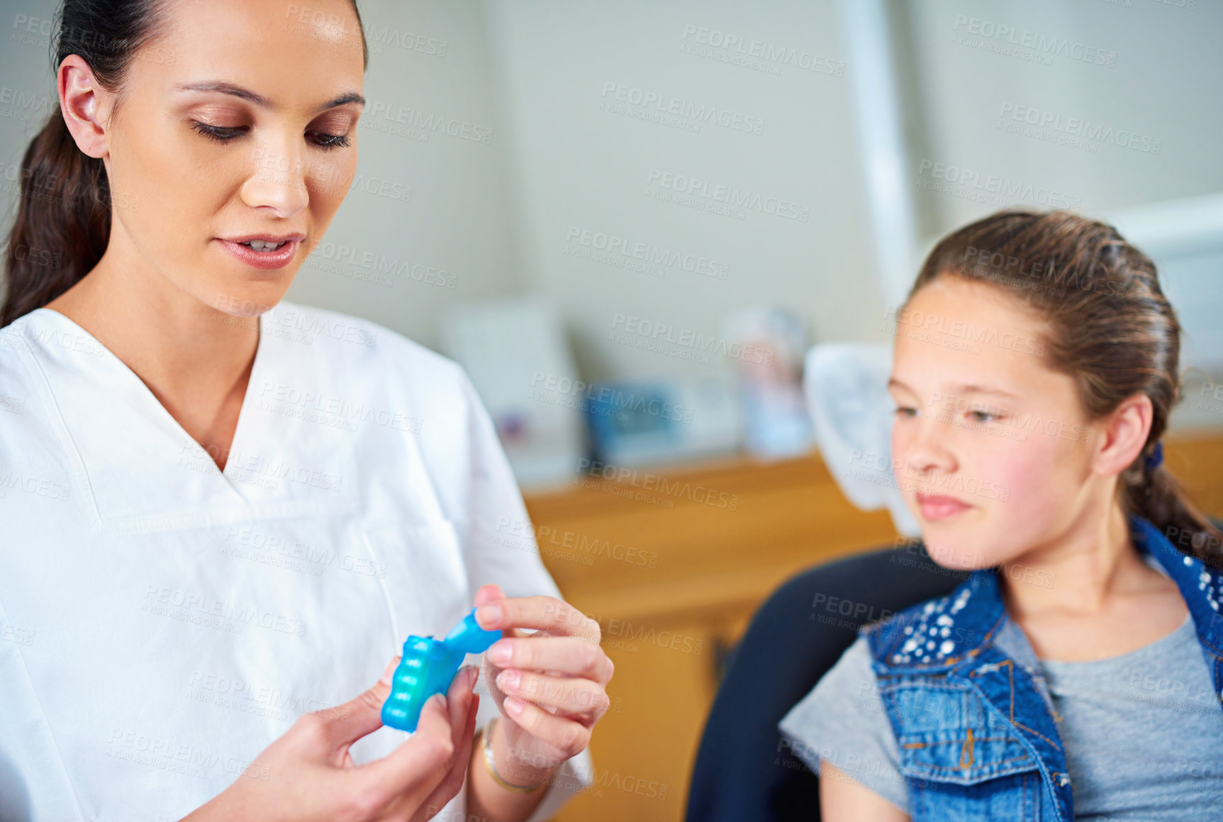 Buy stock photo Woman, dentist and kid with floss, girl and smile in a modern office and wellness with child development. Trust, support and oral health with string or patient with dental hygiene and consultation