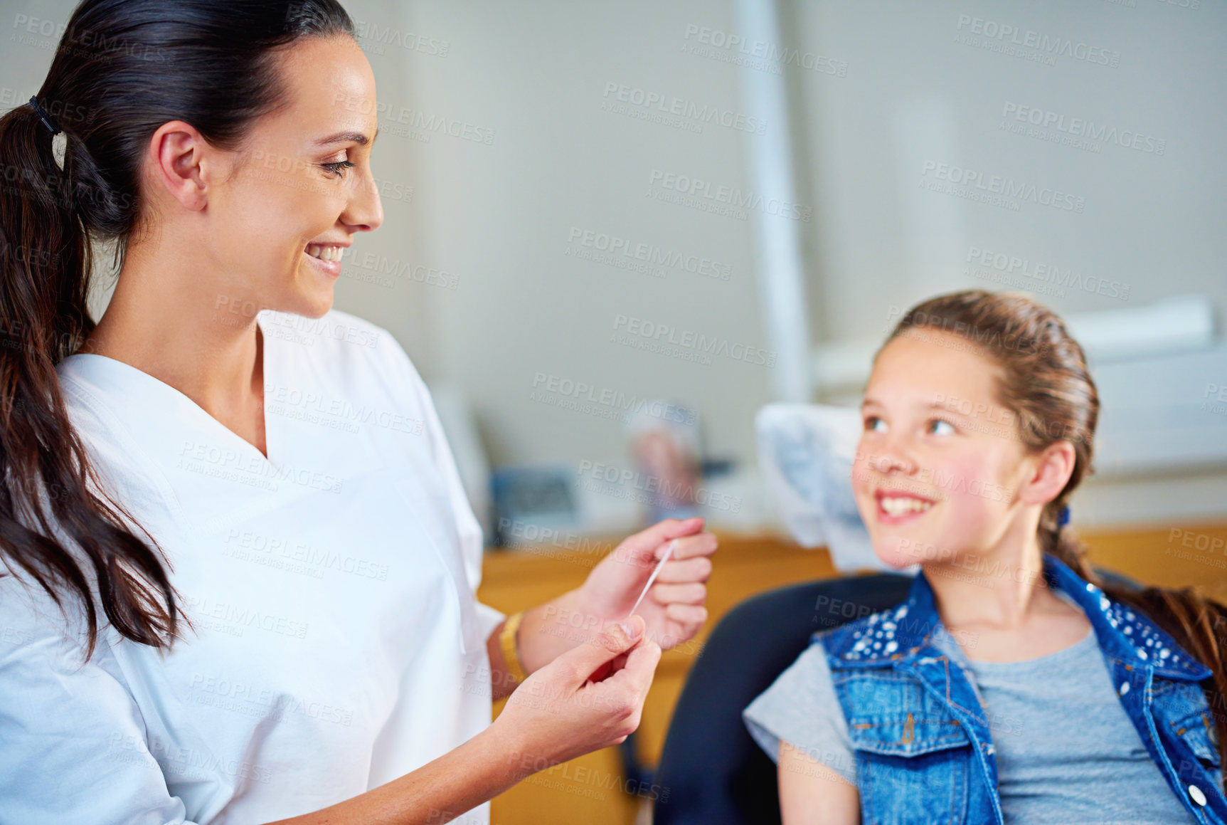 Buy stock photo Woman, dentist and child with floss, girl and smile in a modern office and wellness with care. Trust, support and oral health with string or patient with dental hygiene and cheerful with professional