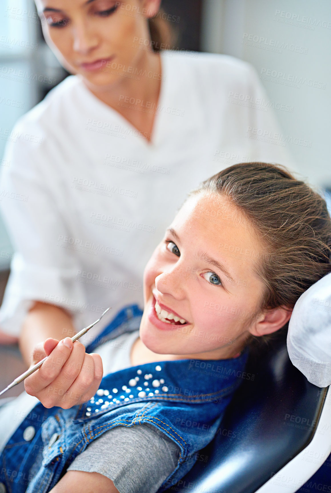 Buy stock photo Girl, child and portrait at dentist for healthcare with dental tool, consultation or mouth inspection for oral health. Orthodontics, kid patient or hand for teeth cleaning, gingivitis or medical care