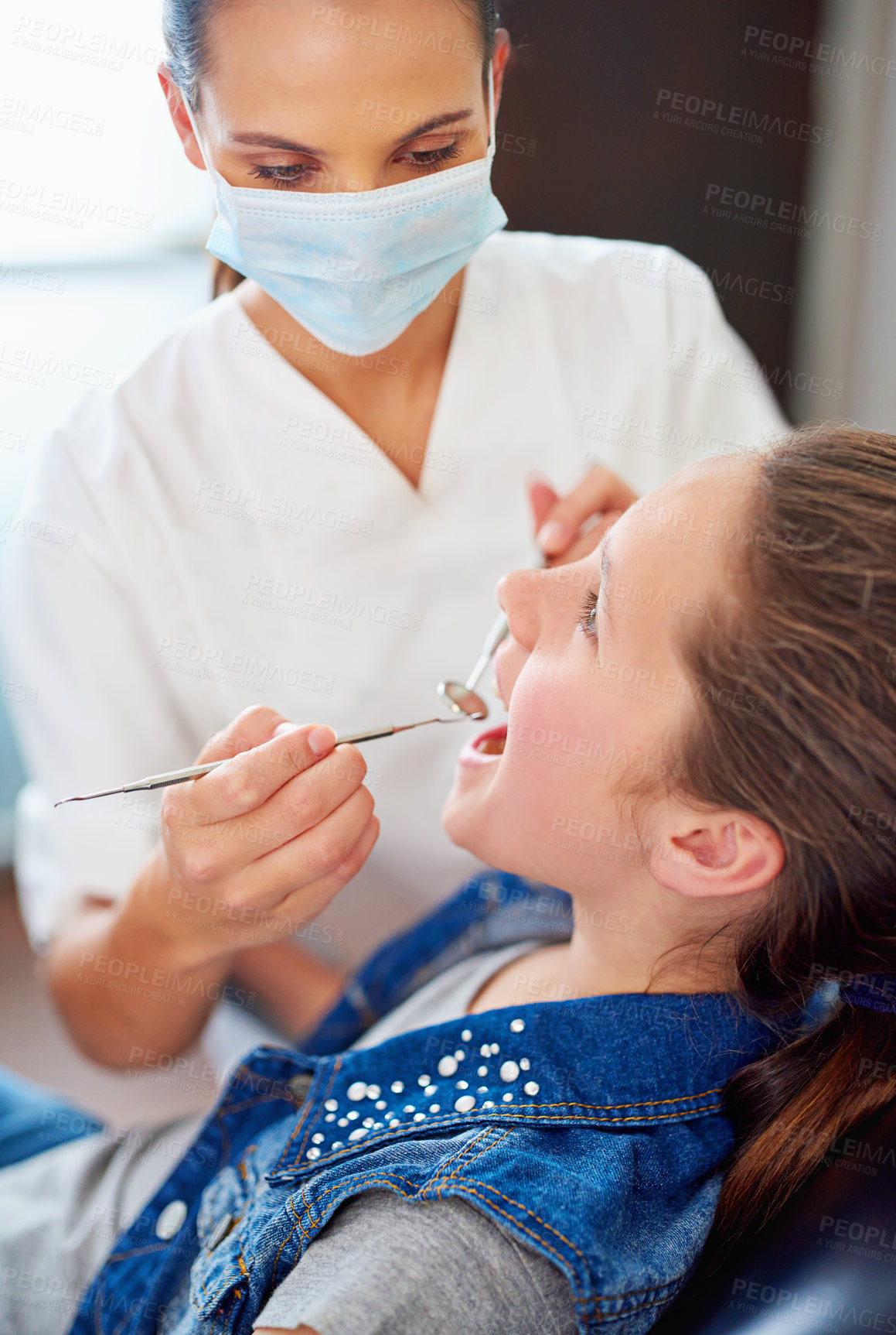 Buy stock photo Professional woman, girl and dentist with tools in hands for teeth check, hygiene and healthcare. Young patient, female orthodontist and cleaning for mouth with braces, tooth decay and gum health