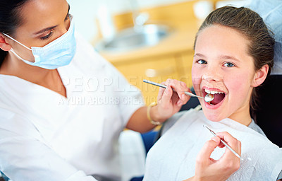 Buy stock photo Portrait of a young girl have a checkup at the dentist