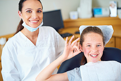 Buy stock photo Okay sign, child and portrait of dentist with clinic for cleaning, teeth whitening and wellness. Healthcare, dentistry and woman and girl with emoji for dental hygiene, oral care and medical services
