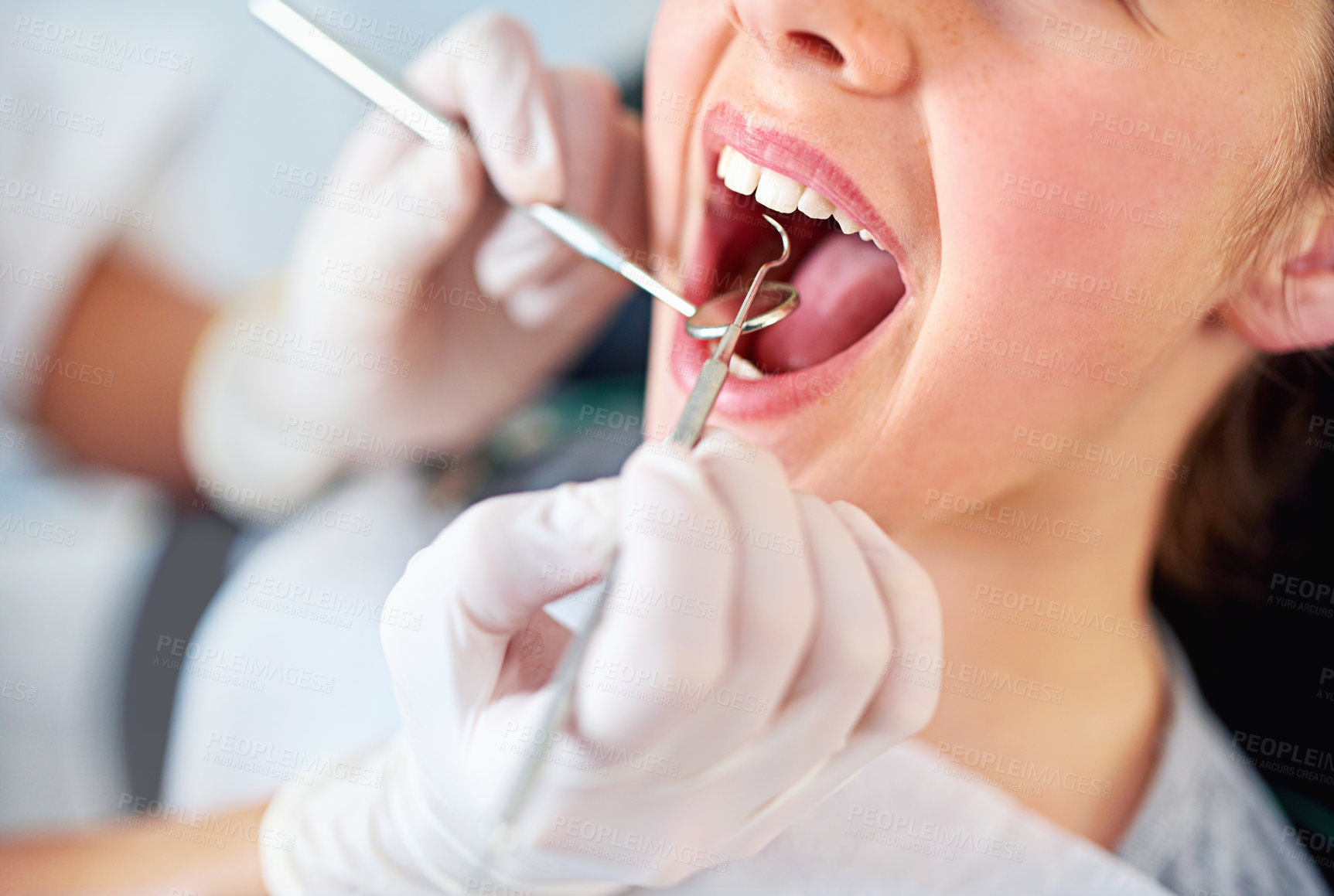 Buy stock photo Girl, kid and mouth inspection at dentist with healthcare tool, consultation or dental mirror for oral health. Professional, child patient or glove hand for teeth cleaning, gingivitis or medical care