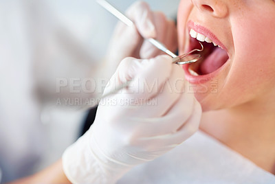 Buy stock photo Closeup shot of a young girl having a checkup at the dentist