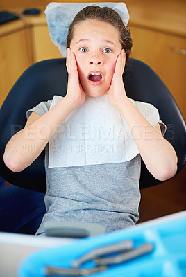 Buy stock photo Fear, scared or portrait of child at a dentist with phobia, panic or overwhelmed by patient exam. Orthodontics, stress or kid nervous for teeth, cavity or bacteria, risk or gum disease emergency