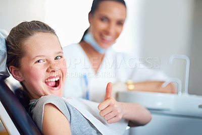 Buy stock photo Portrait of a young girl sitting in a dentist's chair giving a thumbs up