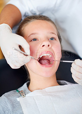 Buy stock photo Girl, kid and mouth inspection at dentist for healthcare with dental tool, consultation or checkup for oral health. Expert, child patient and glove hand for teeth cleaning, gingivitis or medical care