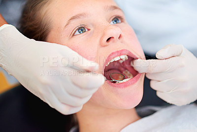 Buy stock photo Girl, child and mirror for inspection at dentist for healthcare with dental tool, consultation and checkup for oral health. Expert, kid and glove hand for teeth cleaning, gingivitis and medical care