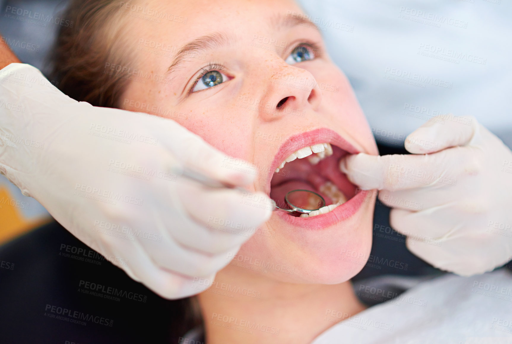 Buy stock photo Girl, child and mirror for inspection at dentist for healthcare with dental tool, consultation and checkup for oral health. Expert, kid and glove hand for teeth cleaning, gingivitis and medical care