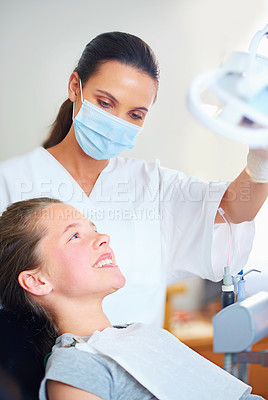 Buy stock photo Child, dentist and smile for teeth whitening, oral healthcare and checkup for cleaning with patient. Woman, girl or kid and happy for tooth, mouth and consultation for cavity, breath or gingivitis   