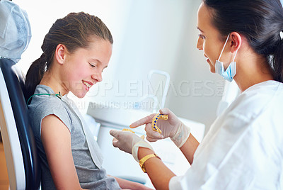 Buy stock photo Child, dentist and patient for teeth whitening, oral healthcare and checkup for cleaning with assessment. Woman, girl or kid and happy for tooth, mouth and consultation for cavity or gingivitis   