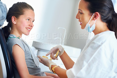 Buy stock photo Child, checkup and smile for dentist, teeth whitening or oral healthcare for cleaning with patient. Woman, girl or kid and happy for tooth, mouth and consultation for cavity, breath or gingivitis   