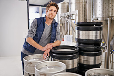 Buy stock photo Brewery, man and portrait with container in factory with confidence, pride and container tank for manufacturing. Industrial, worker and smile in distillery by metal equipment for brewing in warehouse