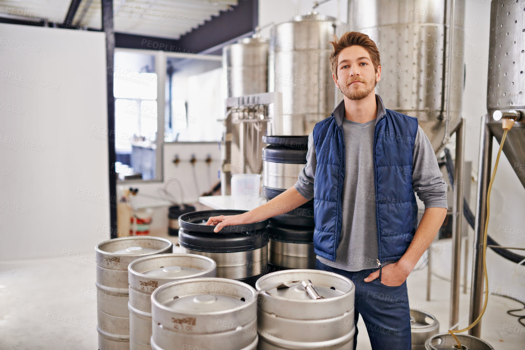 Buy stock photo Brewery, man and tank machine with portrait for craft beer, manufacturing or production process in factory. Industrial industry, worker and smile in distillery with container for brewing in warehouse