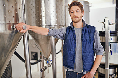 Buy stock photo Brewery, man and manufacturing machine with portrait for craft beer, container or production process in factory. Industrial industry, worker and smile in distillery with tank for brewing in warehouse