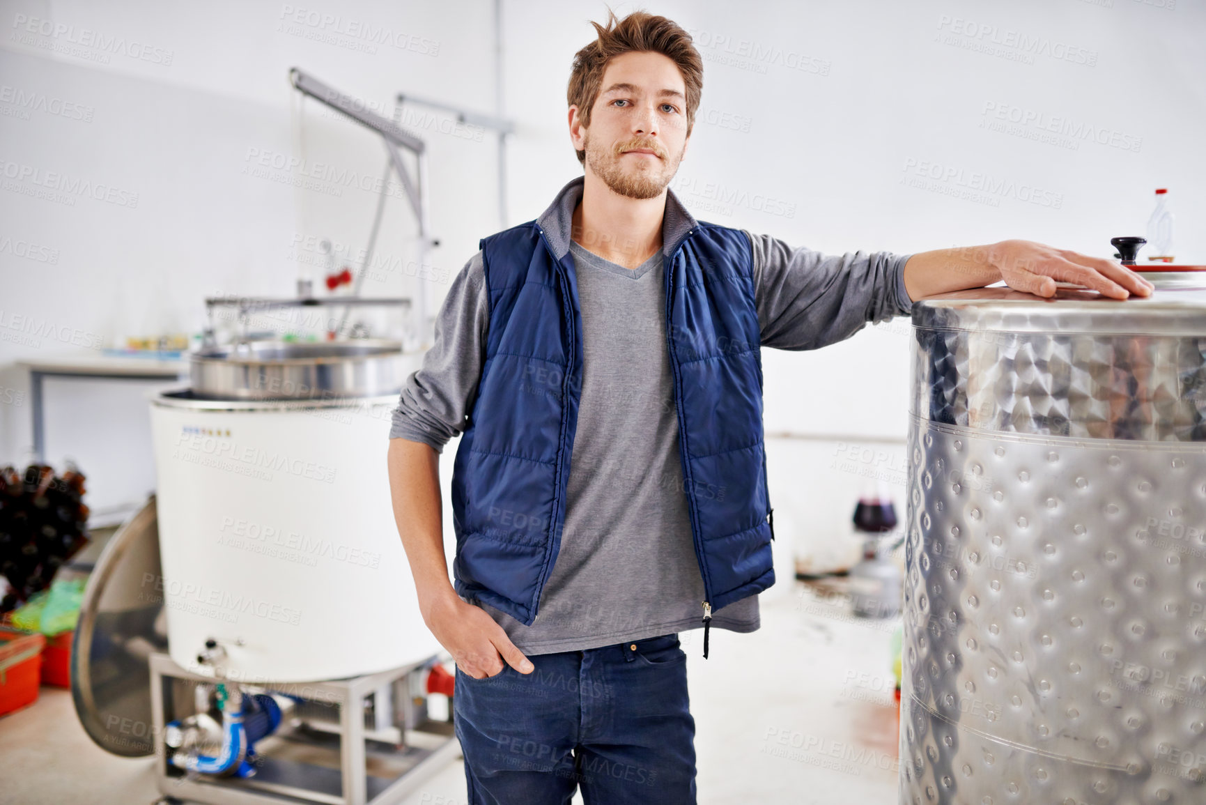 Buy stock photo Brewery, man and portrait by machine with manufacturing for craft beer, alcohol or production process in factory. Industrial metal, worker or pride in distillery with tank for brewing in warehouse