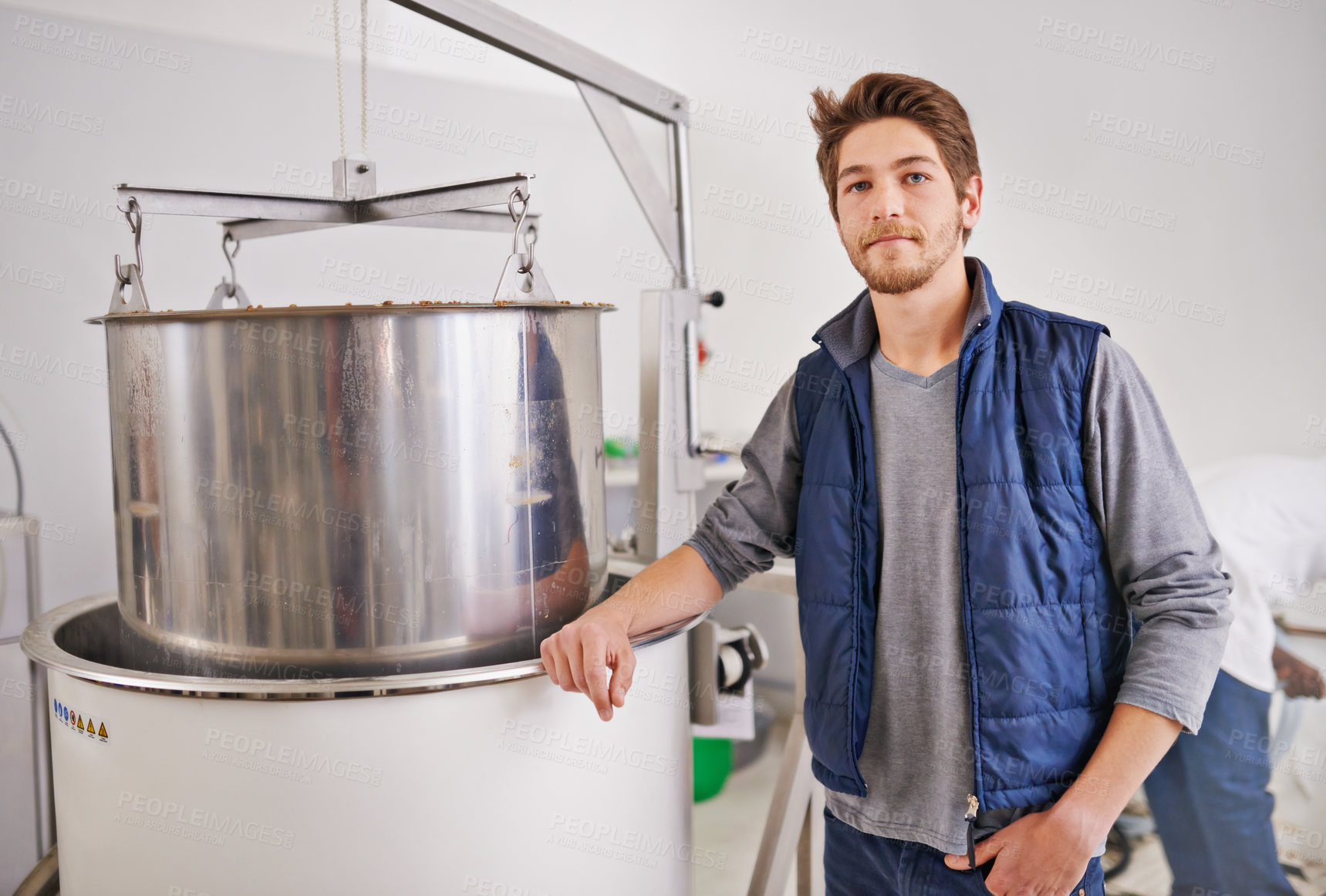 Buy stock photo Brewery, man and portrait by machine with manufacturing for craft beer, alcohol or production process in factory. Industrial industry, worker or smile in distillery with tank for brewing in warehouse