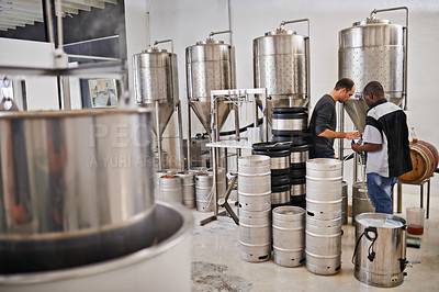 Buy stock photo Brewery, production and people with steel in factory or distillery for winery, alcohol and drink manufacturing. Worker or winemaker checking metal tank, container or  fermentation vessel for beer