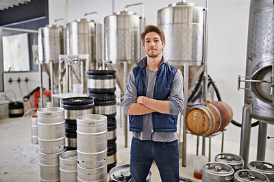 Buy stock photo Brewery, man and portrait with arms crossed in factory with assembly line, pride and container machine for manufacturing. Industrial, worker and smile in distillery with tank for brewing in warehouse