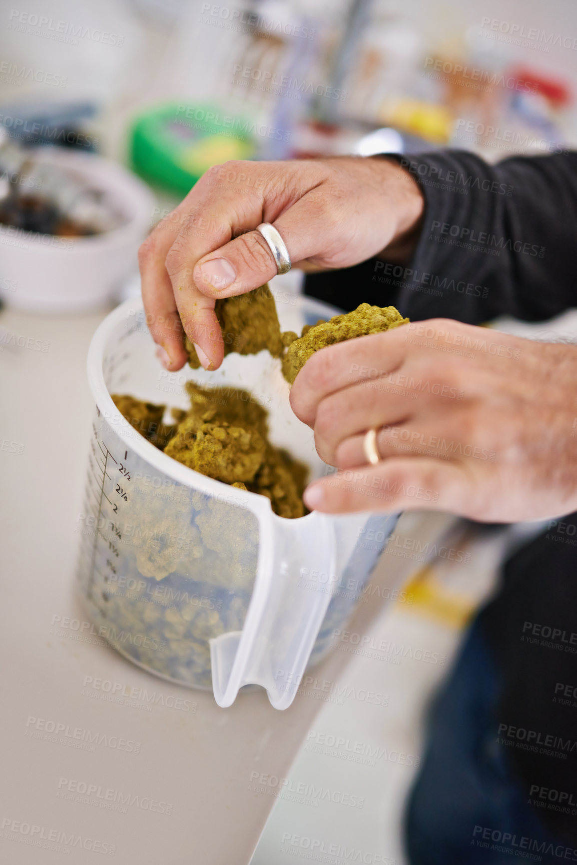 Buy stock photo Beer manufacturing, hops or barley in hands and cup for process, factory or brewery with tools for drink. Person measuring natural ingredients, alcohol production in lab or distillery in industry