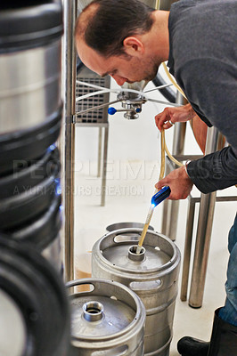 Buy stock photo Brewery, man and pipe in machine with manufacturing for craft beer, alcohol and production process in factory. Industrial industry, worker and working in distillery with tank for brewing in warehouse