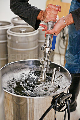 Buy stock photo Brewery, man and hands in container in factory for cleaning pipes, manufacturing tools or machine. Industrial, worker and washing brewing tank for craft beer, alcohol or closeup of production process