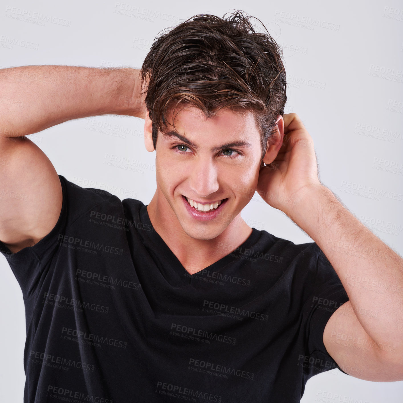 Buy stock photo Handsome man, fashion and style with hair, tshirt or grooming on a gray studio background. Attractive male person, caucasian or young model with trendy hairstyle, casual clothing or barber treatment