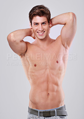 Buy stock photo Happy man, portrait and confidence with muscular body in fitness, health or wellness on a gray studio background. Handsome, attractive or young male person or model with smile and abs in satisfaction