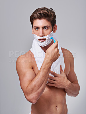 Buy stock photo Razor, shave and man on gray background for wellness, hair removal and beauty treatment in studio. Skincare, dermatology and isolated person with shaving cream for cosmetics, grooming and hygiene