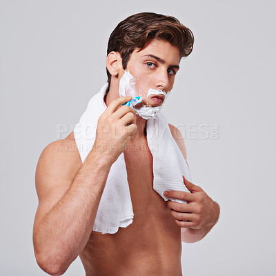 Buy stock photo Razor, shave and portrait of man on gray background for wellness, hair removal and beauty in studio. Skincare, dermatology and isolated person with shaving cream for cosmetics, grooming and hygiene